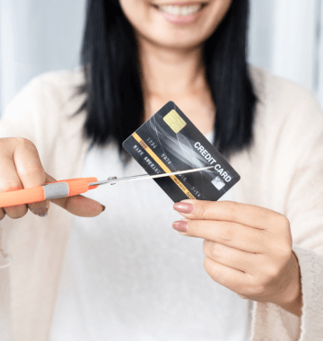 Woman cutting up a credit card